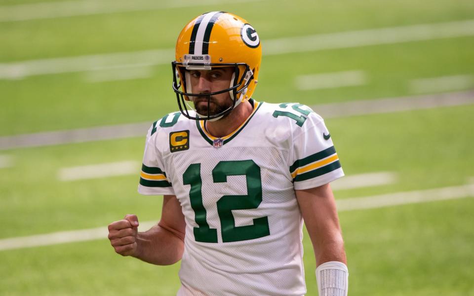 Green Bay Packers quarterback Aaron Rodgers (12) celebrates a touchdown in the fourth quarter against the Minnesota Vikings at U.S. Bank Stadium.  - Brad Rempel-USA TODAY Sports.