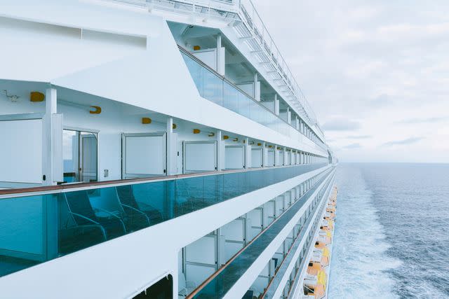 <p>Westend61/Getty Images</p> Cruise ship in the ocean.