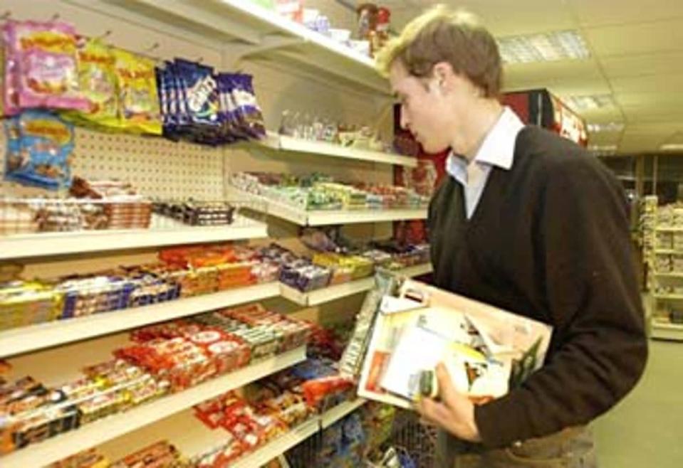 Sweet tooth? Prince William stocks up on standard student fare of crisps and chocolate<br></br>Â© PA: 