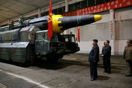FILE PHOTO - North Korean leader Kim Jong Un inspects the long-range strategic ballistic rocket Hwasong-12 (Mars-12) in this undated photo released by North Korea's Korean Central News Agency (KCNA) on May 15, 2017. KCNA via REUTERS/File photo REUTERS