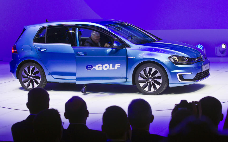 FILE - In this Jan 13, 2014 file photo the Volkswagen e-Golf fully electric vehicle is presented at the North American International Auto Show in Detroit, Michigan. Volkswagen said Thursday, Aug. 23, 2018 it is planning a new e-car-sharing project and will invest in car connectivity. (AP Photo/Tony Ding, file)