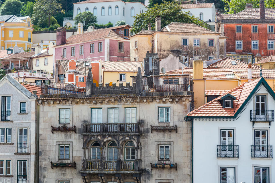 Old multicolored buildings of the center city of Sintra with tourists visiting the old town in the Greater Lisbon region of Portugal