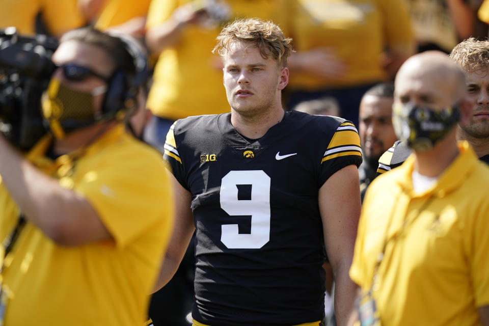 FILE - Iowa punter Tory Taylor (9) stands on the sideline before an NCAA college football game against Kent State in Iowa City, Iowa, in this Saturday, Sept. 18, 2021, file photo. Tory Taylor sells T-shirts that say "Punting Is Winning." Those words describe what's going on at No. 2 Iowa, where Taylor's punting has played a huge factor in the Hawkeyes' 6-0 start. (AP Photo/Charlie Neibergall, File)