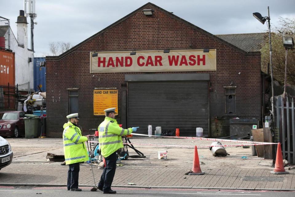 Investigation: Police outside the car wash (PA)