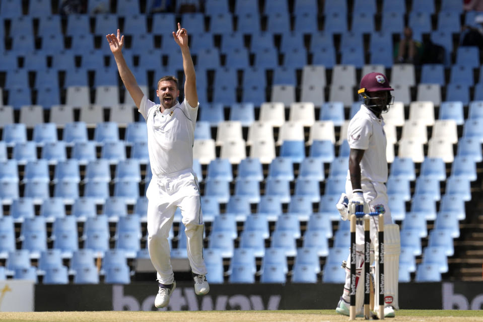 South Africa's bowler Anrich Nortje, left, reacts after dismissing West Indies's batsman Jermaine Blackwood for 37 runs during the second day of the first test cricket match between South Africa and West Indies, at Centurion Park in Pretoria, South Africa, Wednesday, March 1, 2023. (AP Photo/Themba Hadebe)