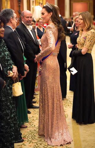 <p>Jonathan Brady / POOL / AFP</p> Kate Middleton attends Buckingham Palace reception on Dec. 5, 2023