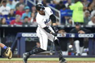 Miami Marlins' Erik Gonzalez hits a double during the fifth inning of a baseball game against the New York Mets, Sunday, June 26, 2022, in Miami. (AP Photo/Lynne Sladky)