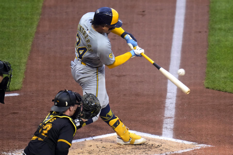 Milwaukee Brewers' William Contreras (24) singles off Pittsburgh Pirates relief pitcher Luis L. Ortiz, driving in a run, during the third inning of a baseball game in Pittsburgh, Wednesday, April 24, 2024. (AP Photo/Gene J. Puskar)