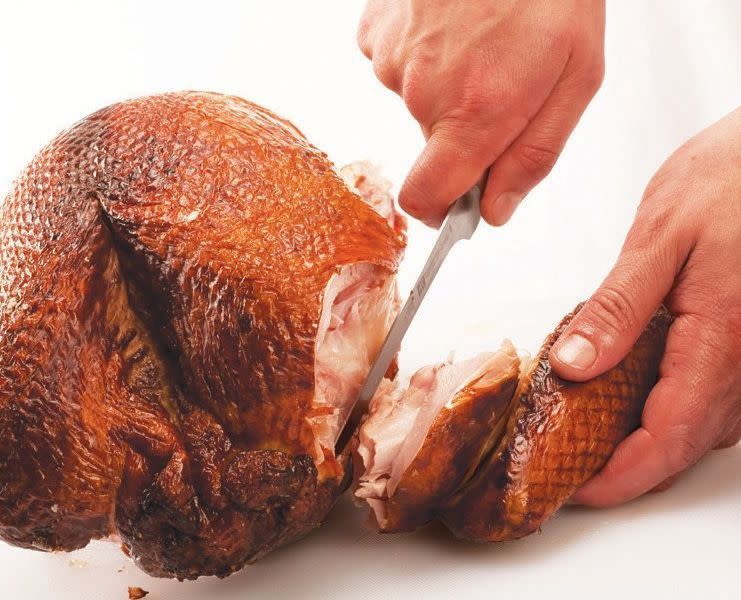Rotate the turkey so that the other wing is facing your guide hand. Repeat previous steps to remove it.  