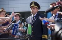 Damir Yusupov, 41-year-old Russian pilot, speaks to the media in Yekaterinburg, Russia, Friday, Aug. 16, 2019. A Russian pilot who managed to smoothly land his disabled plane in a corn field after birds hit both engines said Friday that a quick landing was his only chance and he was not afraid of handling it. (AP Photo)