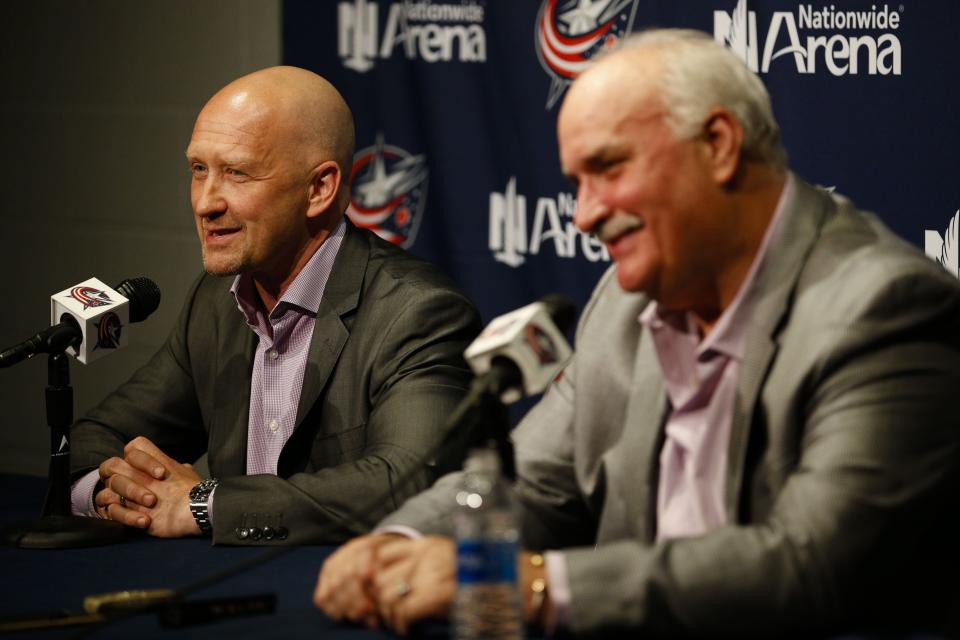 Jarmo Kekalainen, general manager of the Columbus Blue Jackets, left, answers a question as John Davidson, president of hockey operations, right, smiles during an end-of-season press conference on Monday, April 24, 2017 at Nationwide Arena in Columbus, Ohio. [Joshua A. Bickel/Dispatch]