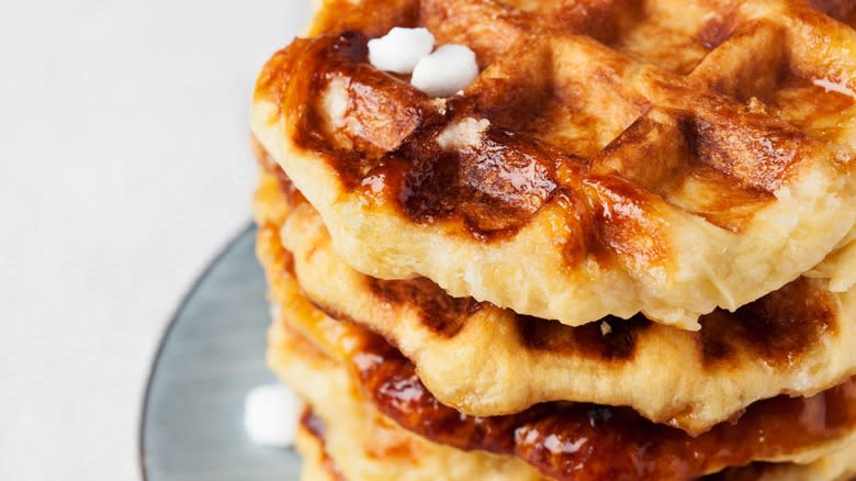 Close-up of Belgian waffles with three pearls of Belgian sugar