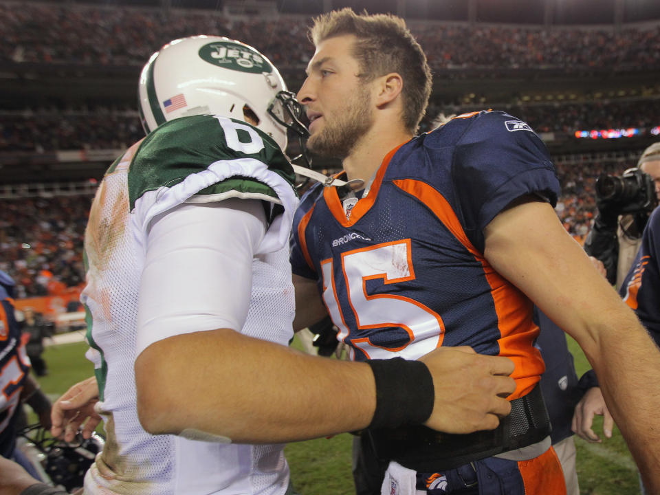 DENVER, CO - NOVEMBER 17: Quarterback Mark Sanchez #6 of the New York Jets and quarterback Tim Tebow #15 of the Denver Broncos meet at midfield after the Broncos defeated the Jets 17-13 at Sports Authority Field at Mile High on November 17, 2011 in Denver, Colorado. Tim Tebow scored the game winning touchdown with 58 seconds remaining in the game. (Photo by Doug Pensinger/Getty Images)
