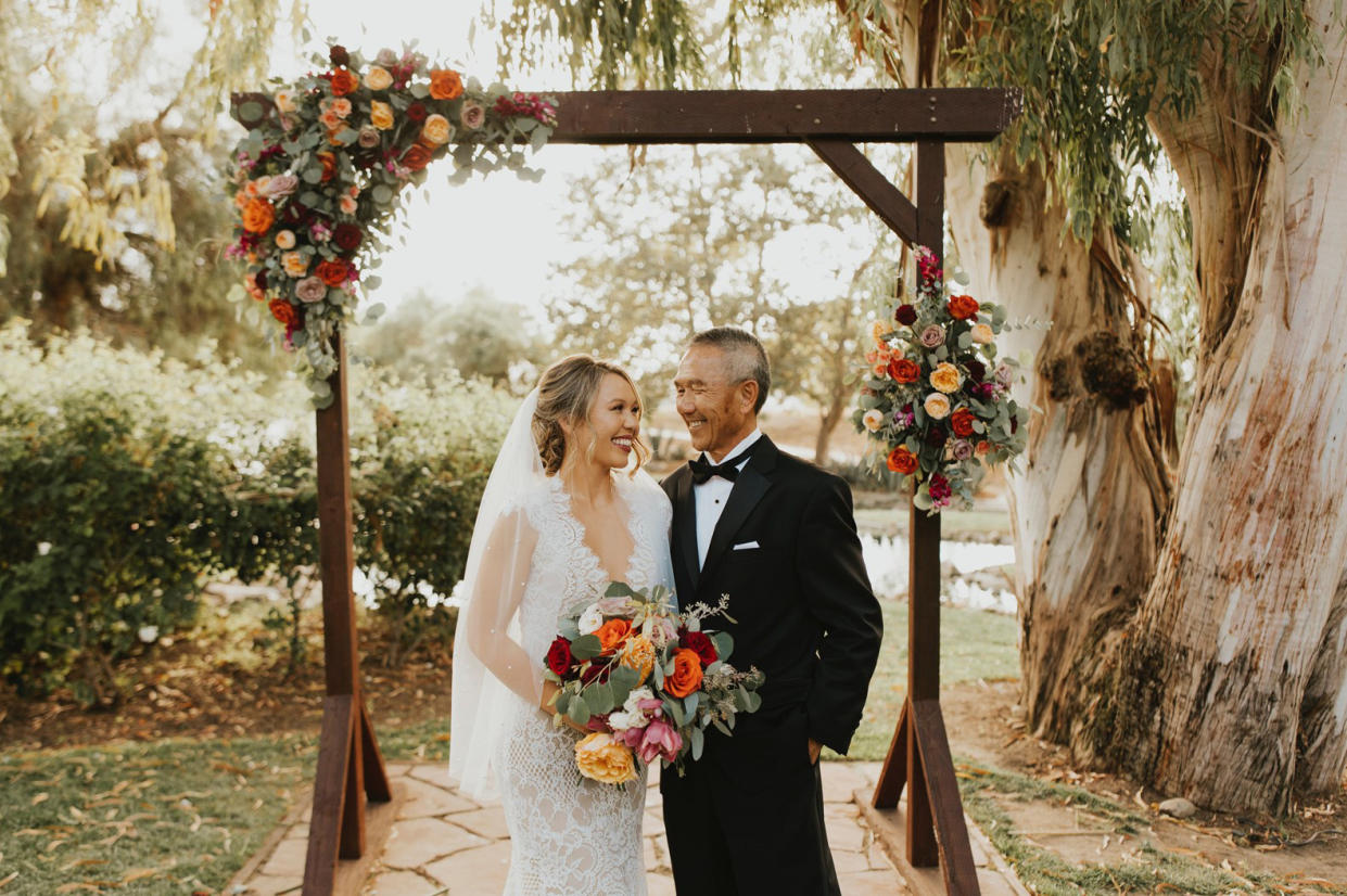 Brittany Revell poses with her father on her wedding day. (Raven Berlin)