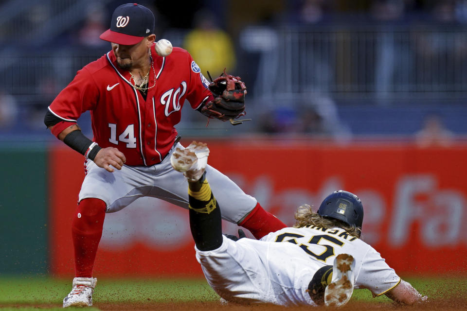 Pittsburgh Pirates' Jack Suwinski steals second as Washington Nationals second baseman Ildemaro Vargas tries to catch the throw during the third inning of a baseball game in Pittsburgh, Tuesday, Sept. 12, 2023. (AP Photo/Matt Freed)