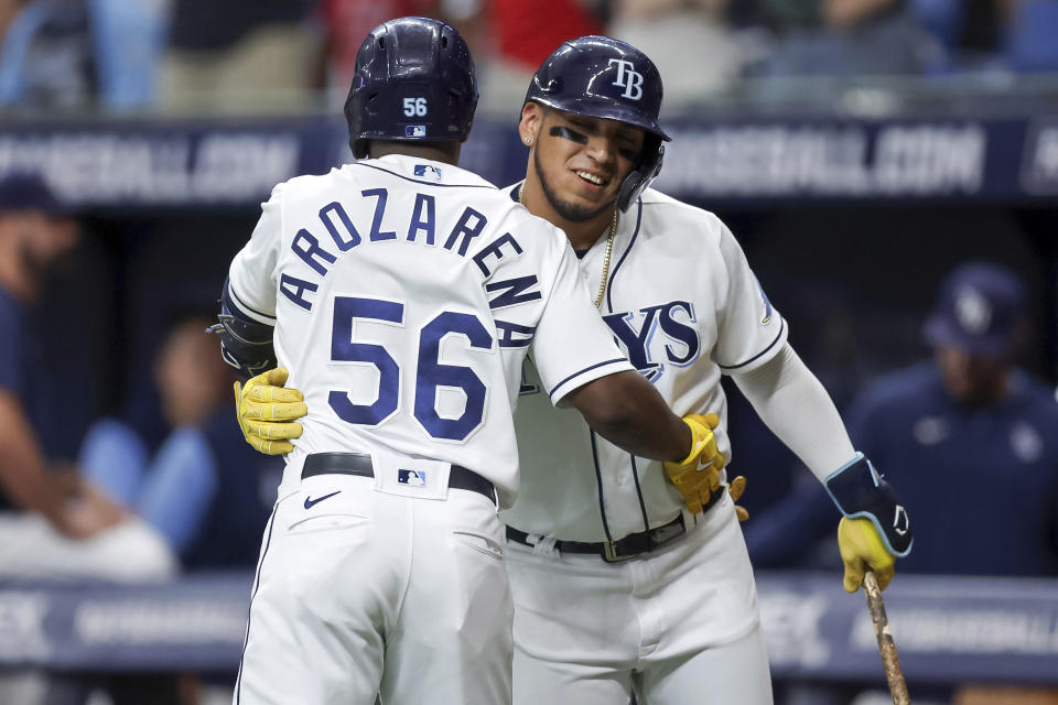 Tampa Bay Rays' Randy Arozarena is congratulated by Isaac Paredes after his three-run home run against the Boston Red Sox during the first inning of a baseball game Tuesday, Sept. 6, 2022, in St. Petersburg, Fla. (AP Photo/Mike Carlson)