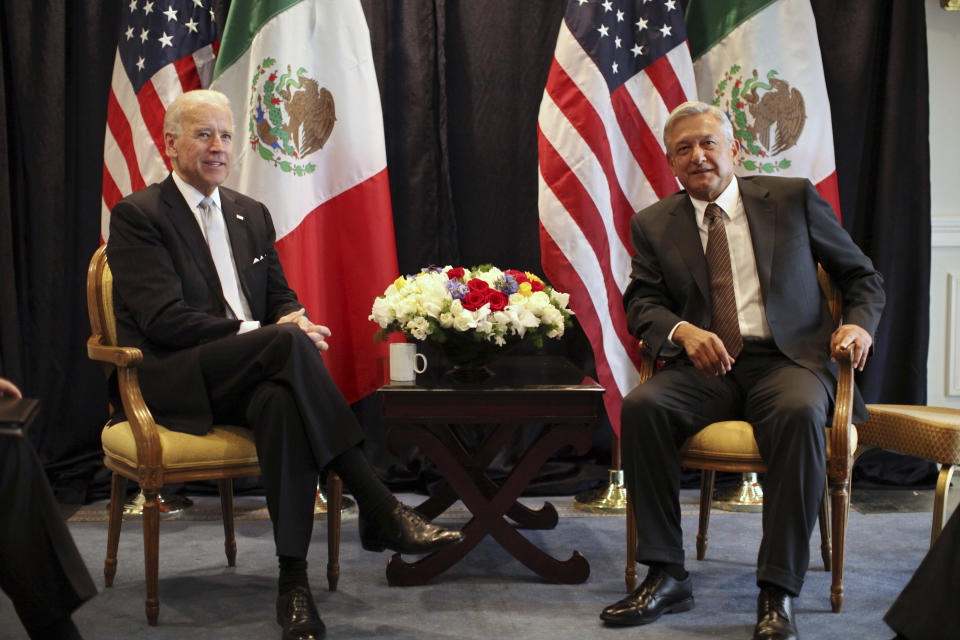 FILE - Then-U.S. Vice President Joe Biden, left, poses for photos with then-Mexican presidential candidate Andres Manuel Lopez Obrador in Mexico City, Monday March 5, 2012. President Biden is planning a virtual meeting with Mexican President Obrador. The meeting, on Monday, March 1, 2021, is a chance for the pair to talk more fully about migration, treating the coronavirus and cooperating on economic and national security issues. (AP Photo/Alexandre Meneghini, File)