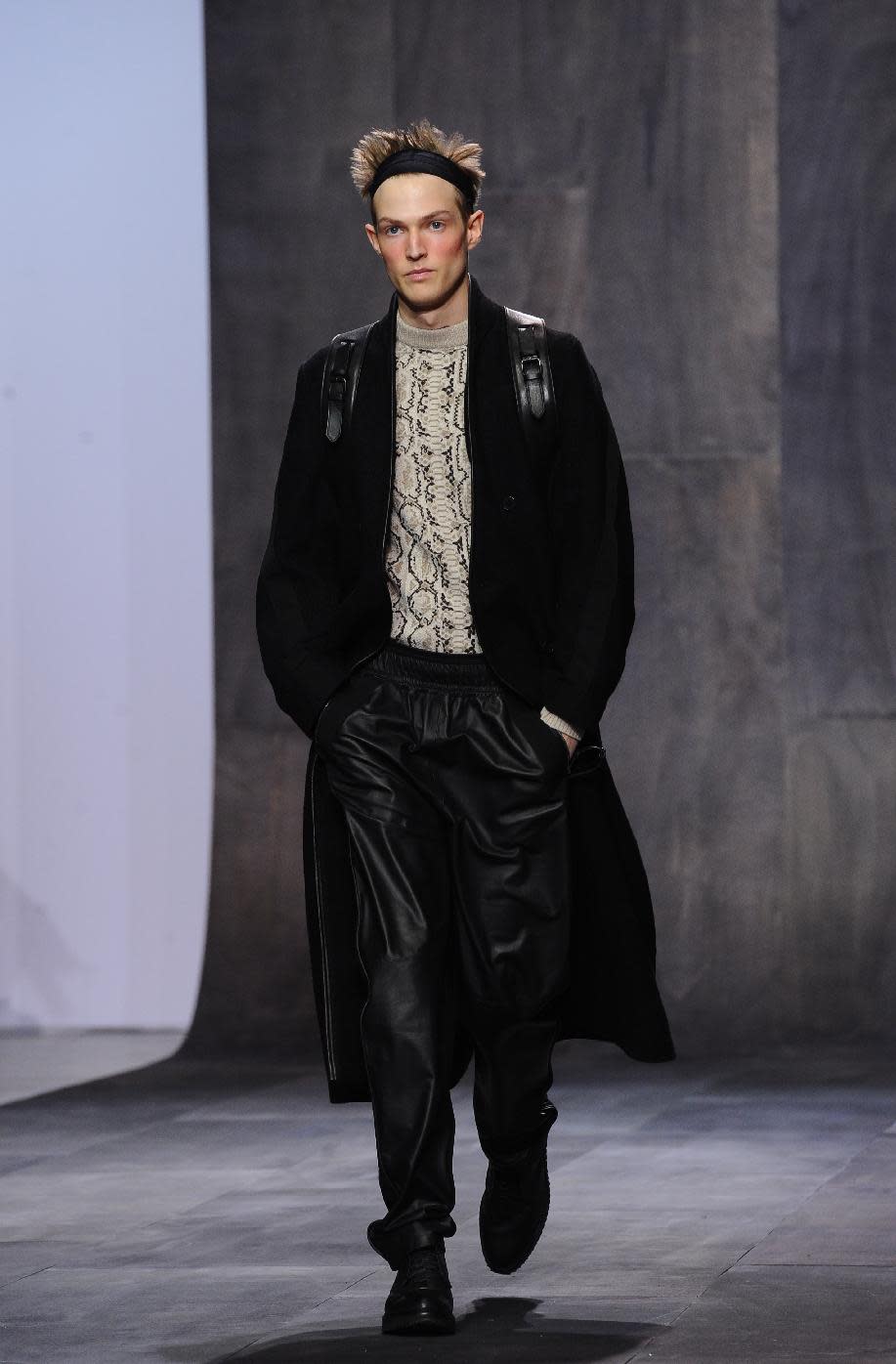 A model wears a creation by fashion designer Damir Doma as part of his fall-winter 2013/2014 men's fashion collection, in Paris, Saturday, Jan. 19, 2013. (AP Photo/Zacharie Scheurer)