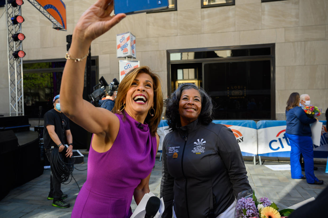 Hoda Kotb celebrated the return of live music on the plaza with a sweet moment with one of the nurses being honored for National Nurses Day.  (Nathan Congelton / TODAY)