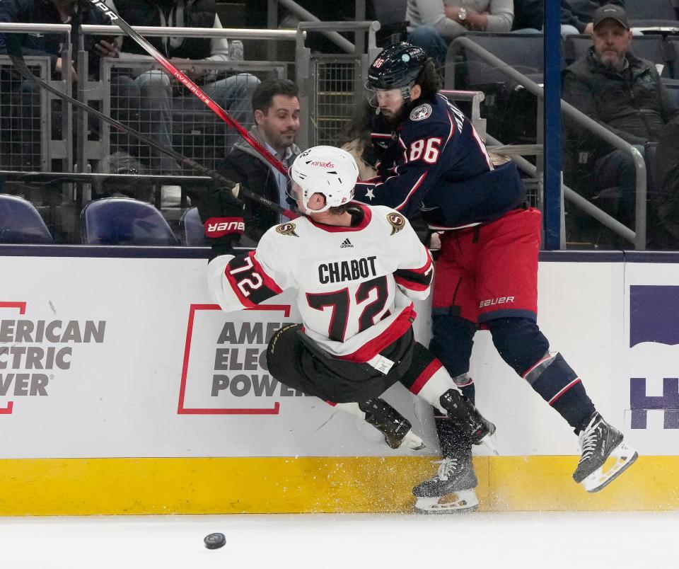 Dec. 1, 2023; Columbus, Ohio, USA; 
Ottawa Senators defenseman Thomas Chabot (72) is checked by Columbus Blue Jackets left wing Kirill Marchenko (86) during the first period of FridayÕs hockey game at Nationwide Arena.