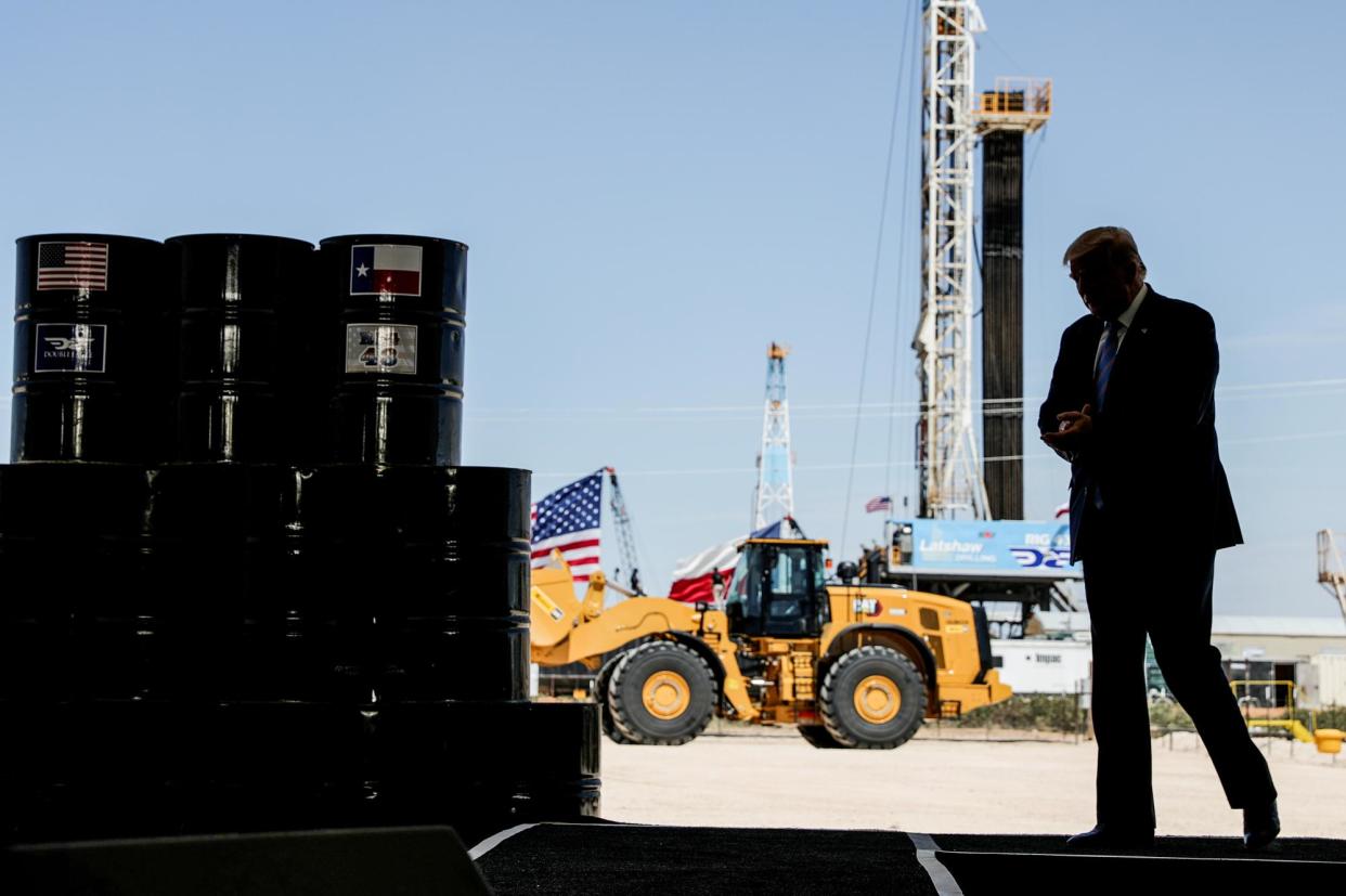 <span>Donald Trump visits the Double Eagle Energy Oil Rig in Midland, Texas, on 29 July 2020.</span><span>Photograph: Carlos Barría/Reuters</span>