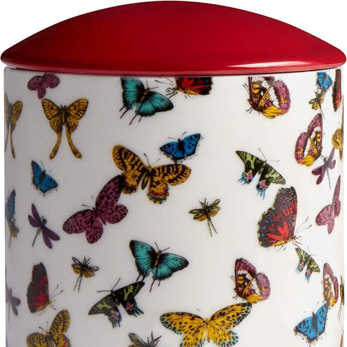 Image of candle with butterfly pattern next to candle box with same pattern
