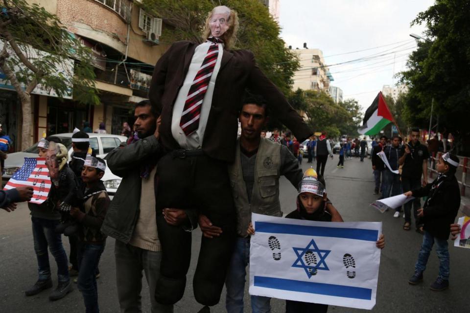 Palestinians hang an effigy bearing a poster of US President Donald Trump in Gaza City this week. (NurPhoto via Getty Images)