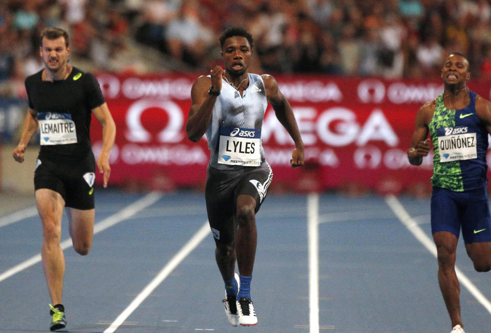 Noah Lyles of USA, center, on his way to win the men's 200 m at the IAAF Diamond League athletics meeting at Charlety Stadium in Paris, Saturday, Aug. 24, 2019. (AP Photo/Michel Spingler)