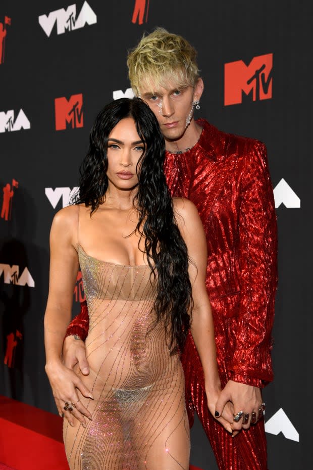 NEW YORK, NEW YORK - SEPTEMBER 12: (L-R) Megan Fox and Machine Gun Kelly attend the 2021 MTV Video Music Awards at Barclays Center on September 12, 2021 in the Brooklyn borough of New York City. (Photo by Kevin Mazur/MTV VMAs 2021/Getty Images for MTV/ ViacomCBS)<p><a href="https://www.gettyimages.com/detail/1339925163" rel="nofollow noopener" target="_blank" data-ylk="slk:Kevin Mazur/MTV VMAs 2021/Getty Images;elm:context_link;itc:0;sec:content-canvas" class="link ">Kevin Mazur/MTV VMAs 2021/Getty Images</a></p>