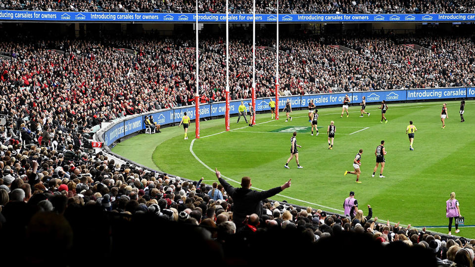 AFL fans, pictured here watching the Essendon Bombers and Collingwood Magpies at the MCG in 2021.