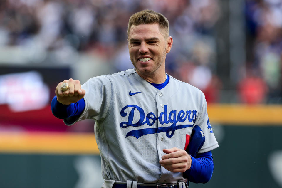 Los Angeles Dodgers first baseman Freddie Freeman shows off his World Series championship ring before the team's baseball game against the Atlanta Braves on Friday, June 24, 2022 in Atlanta. (AP Photo/Butch Dill)