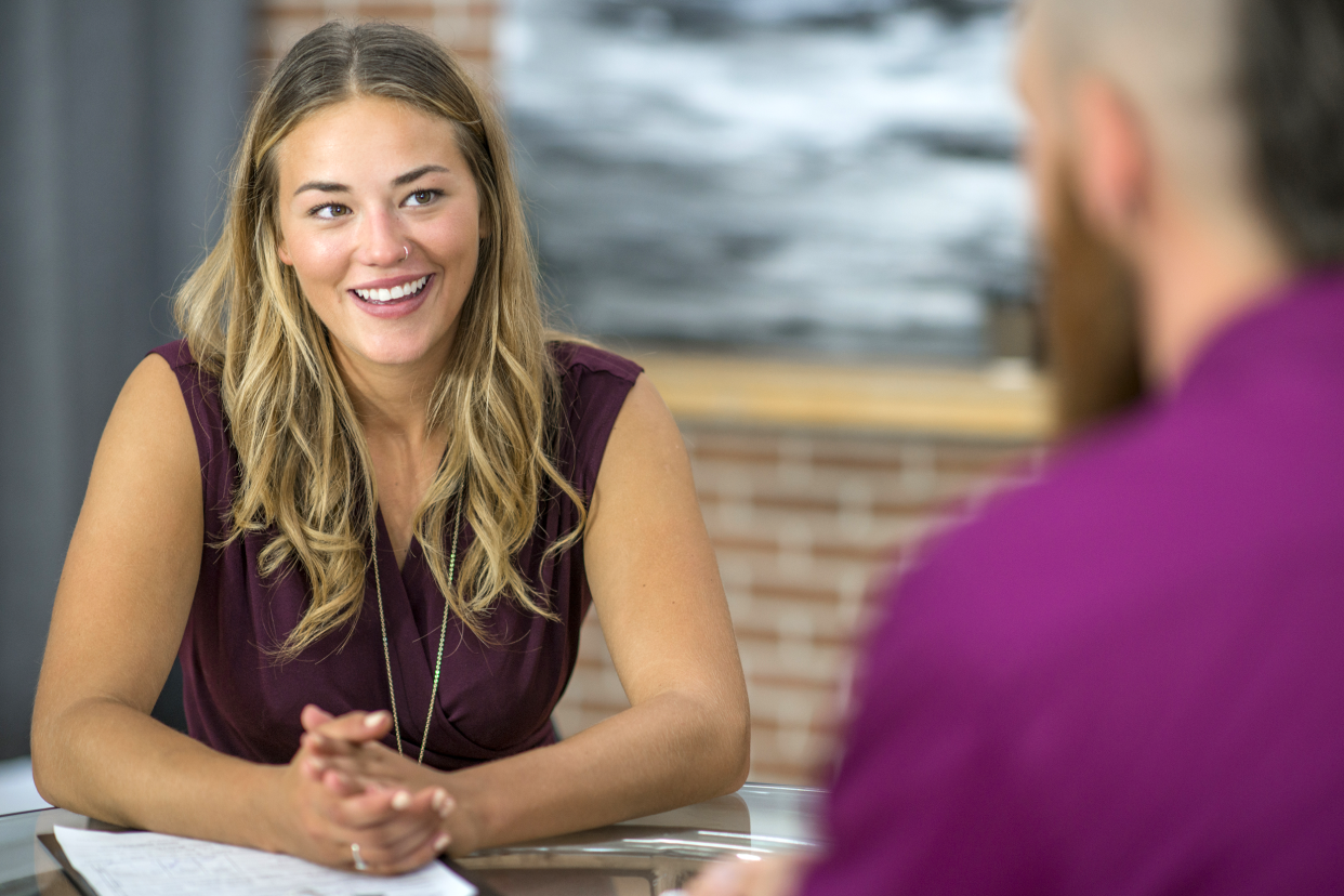 Employee talking privately with her boss