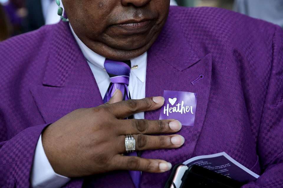 People wore stickers and ribbons to the memorial service.&nbsp;