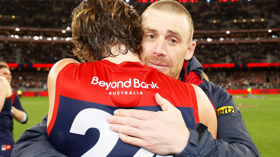 Simon Goodwin, pictured here hugging Trent Rivers after the Melbourne Demons' victory over Geelong.