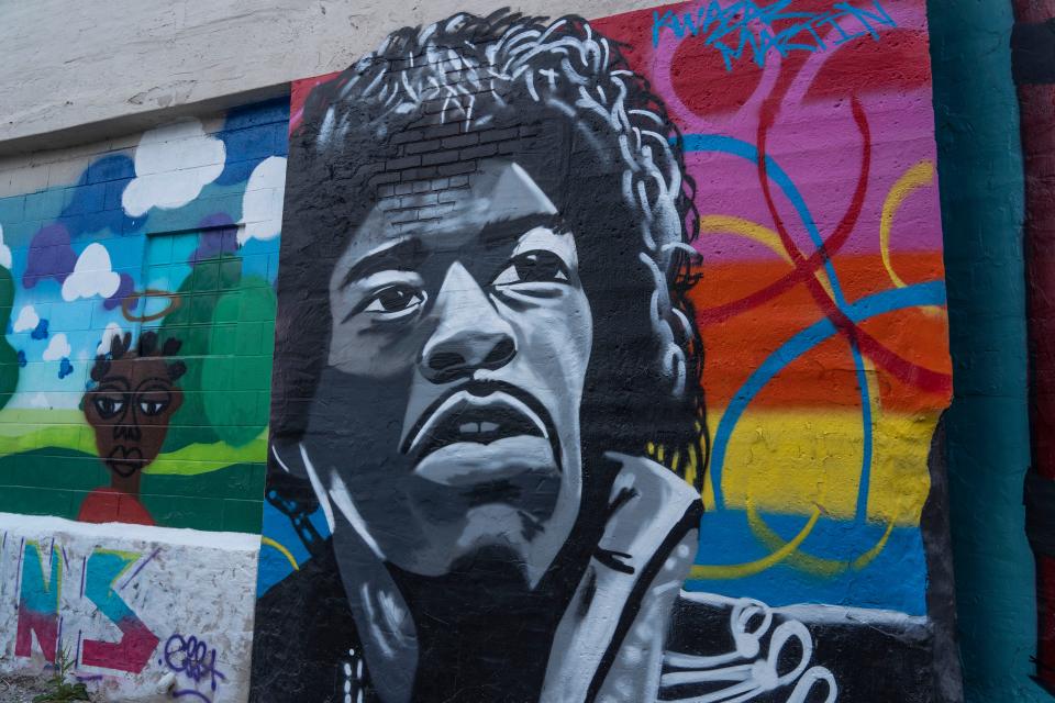 Mural of Rock Superstar Jimi Hendrix behind Square Cat Vinyl in Fountain Square by Kwazar Martin on Tuesday, July 5, 2022 in Indianapolis.