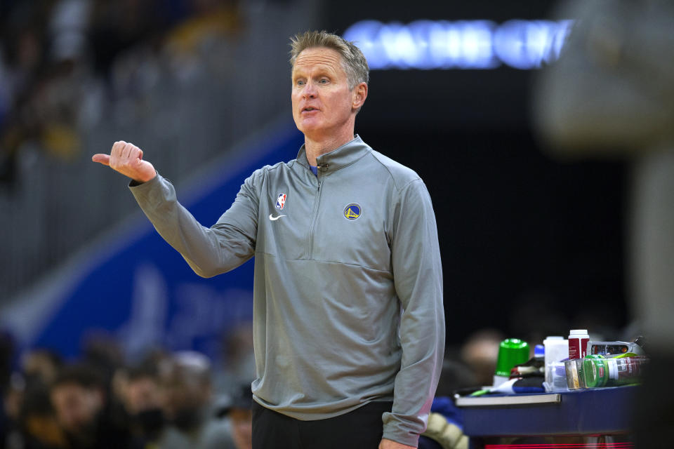 Golden State Warriors coach Steve Kerr signals to players during the first quarter of the team's NBA basketball game against the Philadelphia 76ers, Wednesday, Nov. 24, 2021, in San Francisco. (AP Photo/D. Ross Cameron)