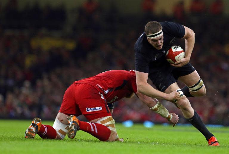 Wales' Jake Ball tackles New Zealand's Brodie Retallick (R) during their Autumn International rugby union Test match, at the Millennium Stadium in Cardiff, south Wales, in November 2014