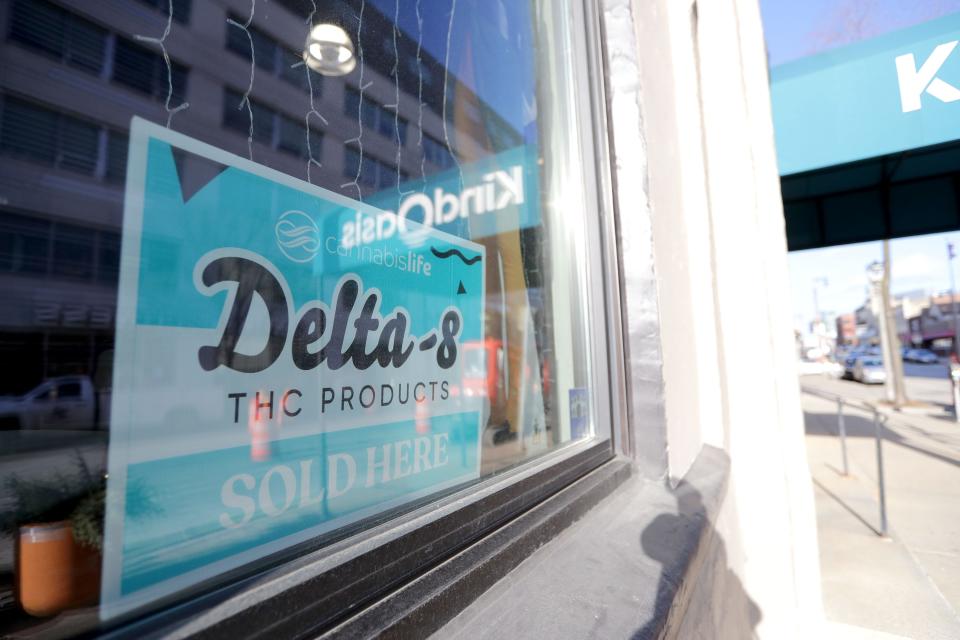 A sign advertises Delta-8 products at Kind Oasis CBD on North Farwell Avenue in Milwaukee  on Thursday, Dec. 16, 2021. Kind Oasis sells Delta-8 products, a Hemp-derived product that is sold around Wisconsin that produces a similar “high” that cannabis produces while still being legal.