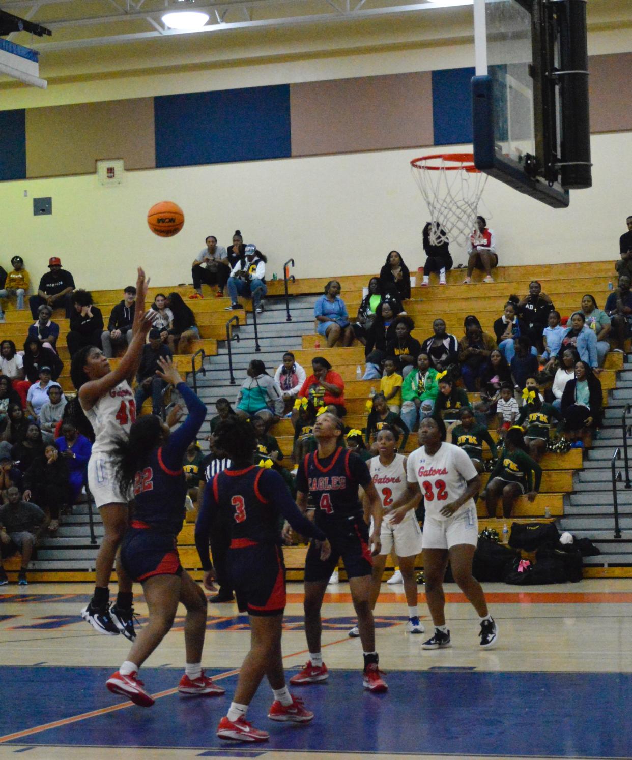 Palm Beach Gardens' Kyana Poitier launches the ball towards the net against Centennial on Feb. 9, 2024.