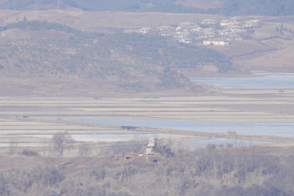 North Korea's town Kaepoong behind a military guard post, bottom, is seen from the unification observatory in Paju, South Korea, Tuesday, Jan. 16, 2024. North Korean leader Kim Jong Un said his country would no longer pursue reconciliation with South Korea and called for rewriting the North’s constitution to eliminate the idea of shared statehood between the war-divided countries, state media said Tuesday. (AP Photo/Lee Jin-man)