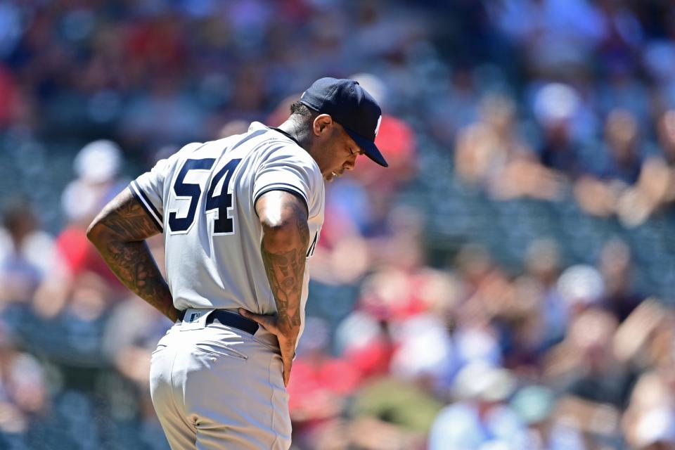 New York Yankees relief pitcher Aroldis Chapman reacts before being removed from the game in the seventh inning in the first baseball game of a doubleheader against the Cleveland Guardians, Saturday, July 2, 2022, in Cleveland. (AP Photo/David Dermer)