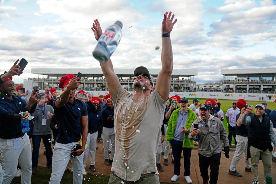 Feb. 9, 2024; Scottsdale, Ariz; USA; A fan pounds two beers together and chugs them before getting arrested near the 17th hole during the second round at the WM Phoenix Open at TPC Scottsdale.