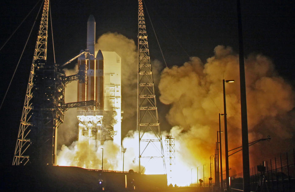 A Delta IV rocket, carrying the Parker Solar Probe, lifts off from launch complex 37 at the Kennedy Space Center, Sunday, Aug. 12, 2018, in Cape Canaveral, Fla. The Parker Solar Probe will venture closer to the Sun than any other spacecraft and is protected by a first-of-its-kind heat shield and other innovative technologies that will provide unprecedented information about the Sun. (AP Photo/John Raoux)