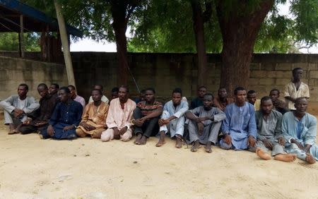 Suspected members of Islamist militant group Boko Haram are pictured after being arrested in Maiduguri, Nigeria July 18, 2018. REUTERS/Ahmed Kingimi