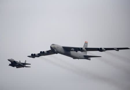 FILE PHOTO: A U.S. Air Force B-52 (R) flies over Osan Air Base in Pyeongtaek, South Korea, January 10, 2016. REUTERS/Kim Hong-Ji