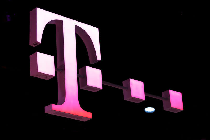 FILE PHOTO: A Deutsche Telekom logo at the Mobile World Congress in Barcelona, Spain, February 26, 2018. REUTERS/Yves Herman