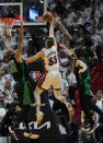 Miami Heat guard Duncan Robinson (55) drives to the basket as Boston Celtics centers Robert Williams III (44) and Al Horford (42) defend during the second half of Game 5 of the NBA basketball Eastern Conference finals playoff series, Wednesday, May 25, 2022, in Miami. (AP Photo/Lynne Sladky)