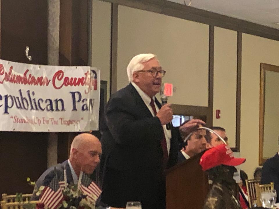Longtime Columbiana County Republican Party chairman Dave Johnson welcomes guests at Wednesday night's Lincoln Day Dinner in Salem. Johnson has led the local party since 1989.