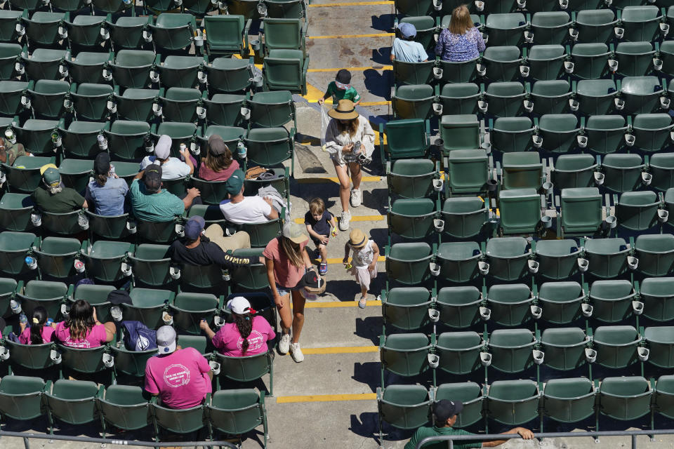 Fans attend the first baseball game of a doubleheader between the Oakland Athletics and the Detroit Tigers in Oakland, Calif., Thursday, July 21, 2022. (AP Photo/Godofredo A. Vásquez)