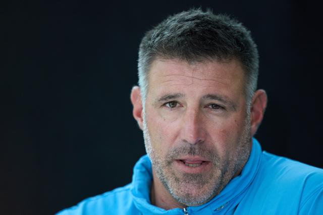 Tennessee Titans coach Mike Vrabel walks out of Friday's press